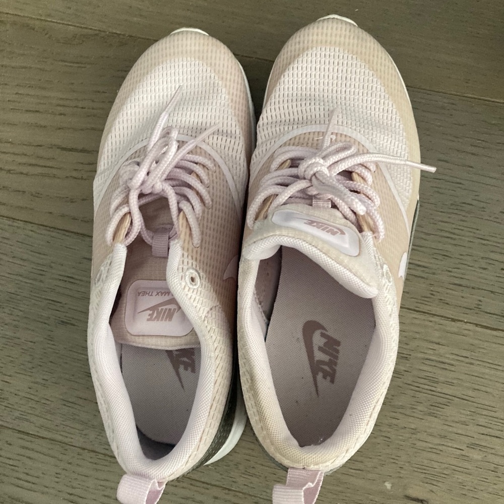 Light pink Nike sneakers.